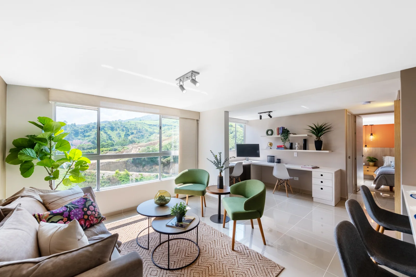 Sala y comedor integrados del apartamento modelo de El Bosque.